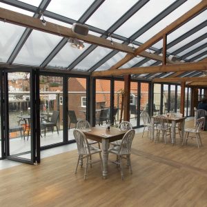 Black aluminium bifold door design and installation for Restaurant