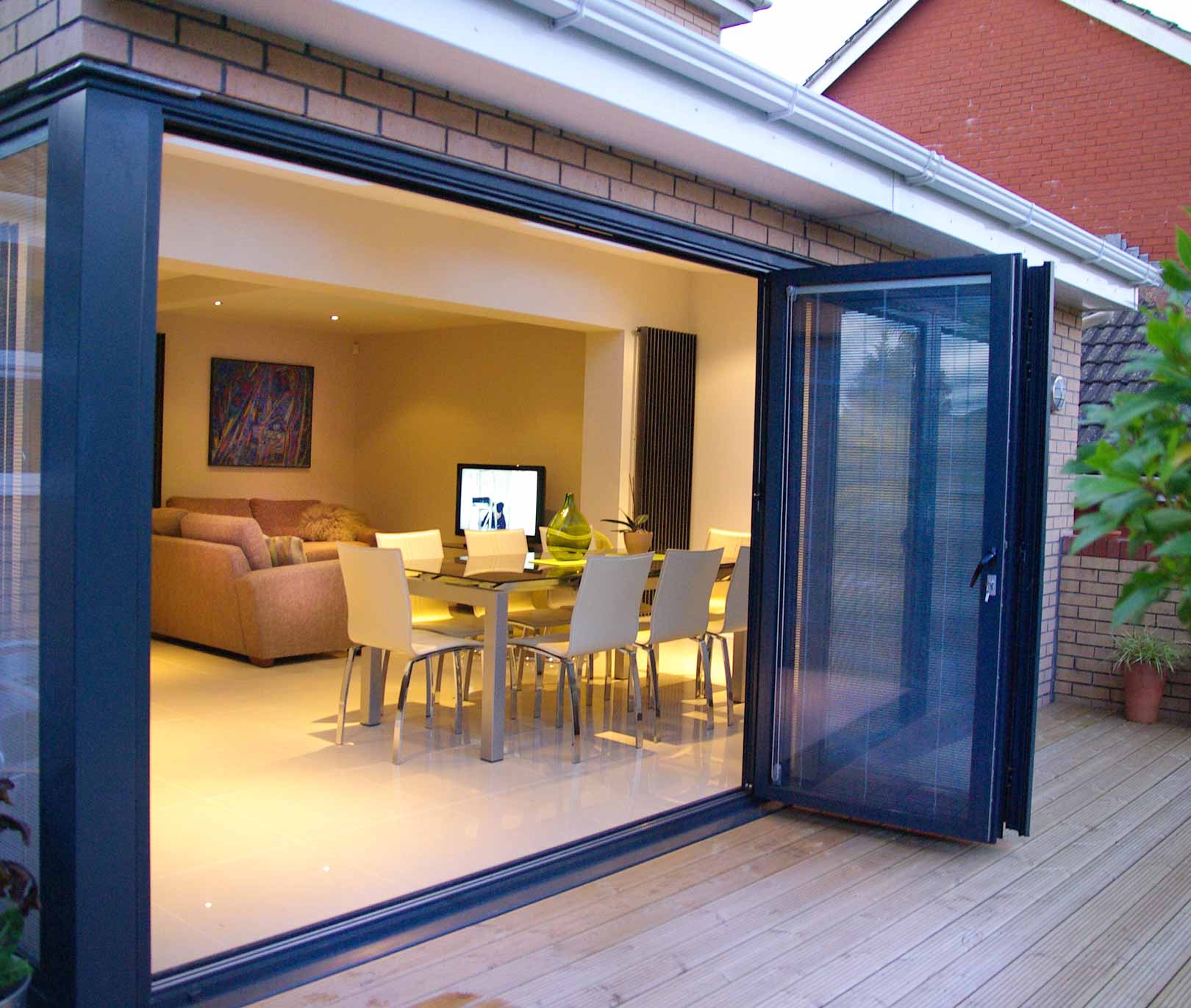 Black aluminium bifold door integral blinds