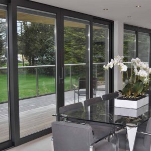 Black aluminium sliding patio door with integral blinds